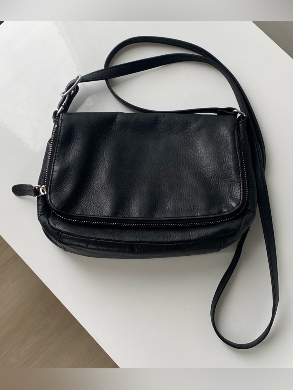 Margot New York black genuine leather S/M crossbody with silver hardware.